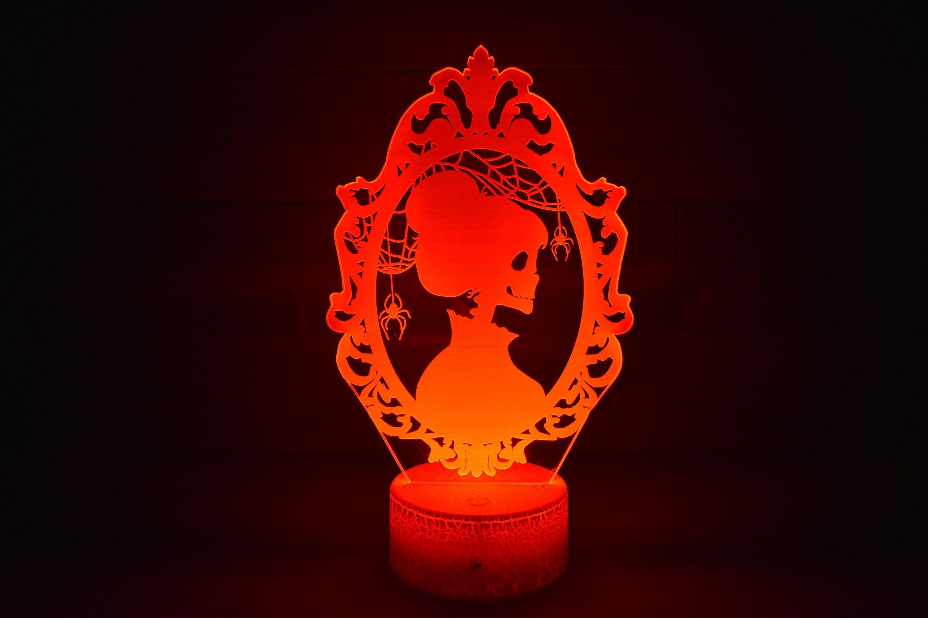 Skeleton Silhouette couple dressed ready for Halloween. LED Lamp with 16 colors and batteries included.